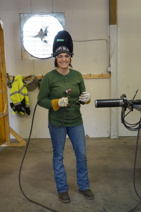 female welder in workshop